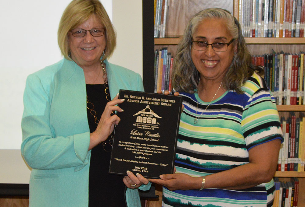 Tracie O'Geary, member of the NM MESA Board of Directors, presents the Guenther Award to Luisa Castillo