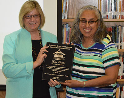 Tracie O'Geary, member of the NM MESA Board of Directors, presents the Guenther Award to Luisa Castillo